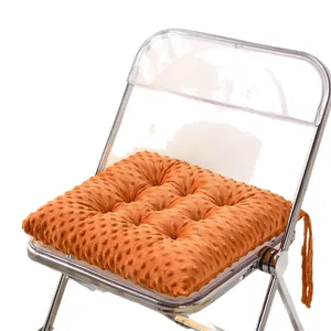 Thick orange minky dot seat cushion shown on a transparent chair for office comfort