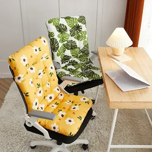 Integrated chair cushions with floral and leaf patterns in a cozy office setting
