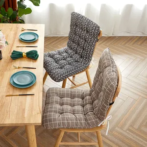 Padded high back chair cushions with geometric patterns on wooden dining chairs