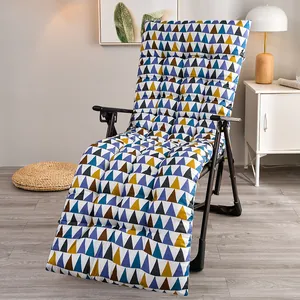 Thick padded lounge chair cushion with colorful geometric triangle pattern in a home setting.
