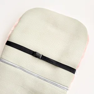Detail view of heated seat cushion back with non-slip base and adjustable strap