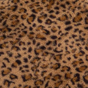 Macro close-up detail of soft leopard print plush fabric on winter chair cushion