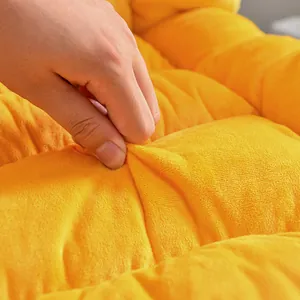 Detailed close-up showing the soft and plush yellow fabric texture of the heated seat cushion.