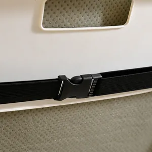 Close-up detail of the adjustable strap and buckle on an electric heated chair cushion.