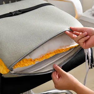 Detail of electric heated chair cushion showing zipper and internal heating layers.