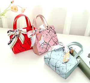 Selection of small marble pattern square bags with decorative silk scarves in multi colors