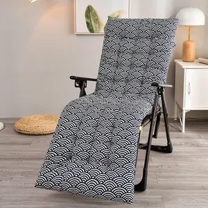 Close-up detail of thick recliner cushion featuring a blue and white wave pattern design