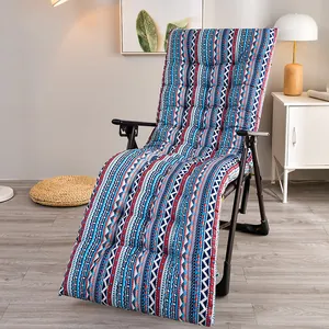 Detailed view of thick reversible recliner cushion with ethnic geometric pattern.