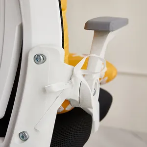 Close-up of a thickened yellow chair cushion tied to a white office chair frame