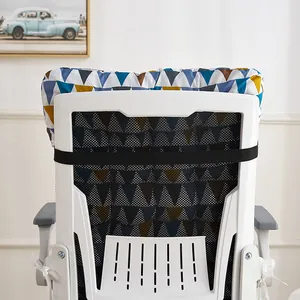 Back view of geometric patterned chair cushion with elastic strap on office chair