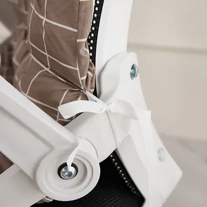Close-up detail of white ribbon tie on brown grid thickened office chair cushion backrest