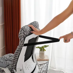 Close-up of elastic strap on thickened grey leaf pattern chair cushion.