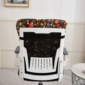 Detail showing the secure strap of a thickened floral chair cushion on a white office chair