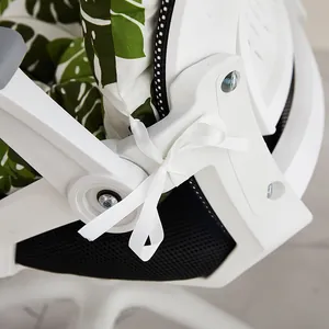 Close-up of integrated seat cushion with tropical leaf pattern and white ribbon tie