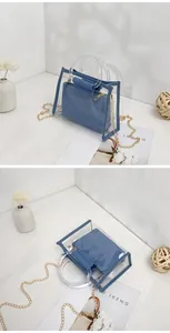Trendy blue 2-in-1 transparent PVC handbag set with clear handles and gold chain strap