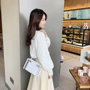 Fashionable white transparent PVC crossbody bag with inner pouch and gold chain strap