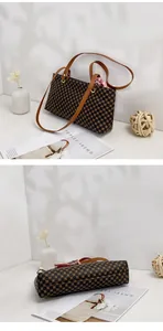 Detailansichten einer gemusterten Handtasche mit Seidenschal und flachem Boden