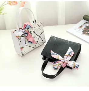 Stylish marble pattern square handbags featuring elegant pink silk scarf ribbons