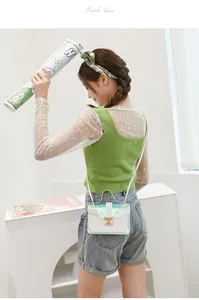Stylish iridescent transparent quilted crossbody bag shown on model in a modern studio