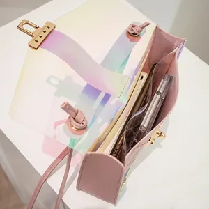 Trendy holographic transparent shoulder bag with gold lock and elegant pink accents
