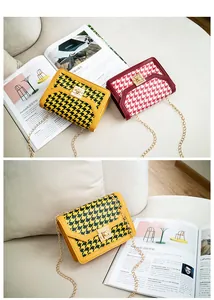 Detailed view of trendy houndstooth crossbody bags with elegant gold chain and metal lock