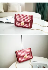 Elegant red and white houndstooth chain shoulder bag with stylish gold lock closure