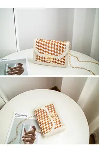 Detailed views of a chic houndstooth small square bag with elegant gold chain strap