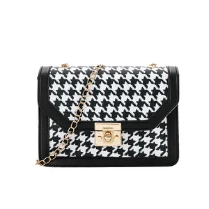 Elegant black and white houndstooth print small square crossbody bag with gold chain strap