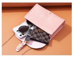 Pink stone pattern chain crossbody bag showing capacity for phone, lipstick and wallet