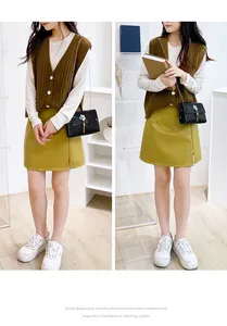 Fashionable black laser crossbody bag with gold tassel shown in model lifestyle shot