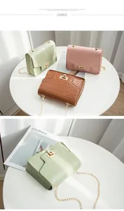 Detailed view of crocodile pattern chain crossbody small square bags in multiple colors