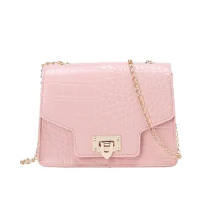 Pink crocodile pattern women's shoulder bag with gold chain strap and lock clasp.