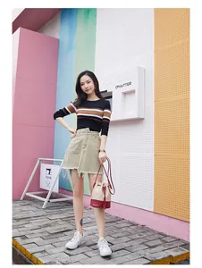 Stylish color-block drawstring bucket bag with diamond stitching shown on model outdoors.