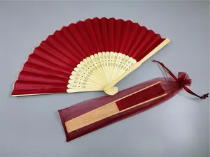 Red silk folding fan with bamboo ribs and matching organza gift bag for weddings