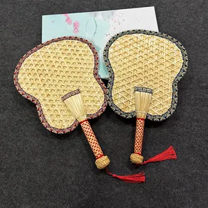 Traditional handwoven natural straw hand fan with exquisite red decorative tassels