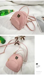 Close-up of pink mini backpack with cute rabbit ear hardware and versatile long straps