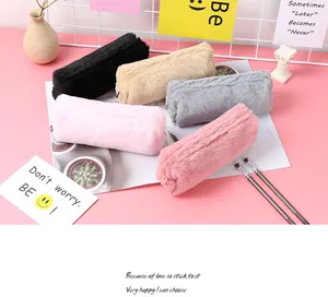 Detailed view of colorful plush octagonal pencil pouches in multiple pastel colors