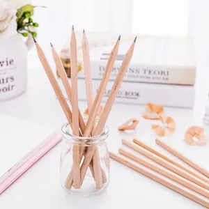 Detailed macro shot of natural wood HB pencils in a glass jar with scattered shavings