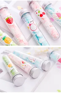 Detailed macro shot of portable soap paper flakes in various fruit-themed travel test tubes