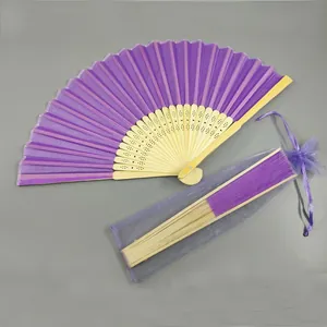 Elegant purple folding fan with bamboo ribs and matching organza gift bag for wedding favors