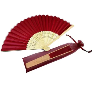 Elegant red silk folding fan with bamboo ribs and matching organza bag for wedding gifts