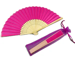 Elegant magenta silk folding fan with bamboo ribs and matching organza gift bag.