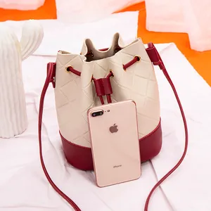 Elegant contrast color quilted drawstring bucket bag with slim adjustable shoulder strap