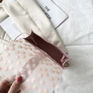 Elegant pink crossbody phone bag featuring a floral embroidered mesh flap for women