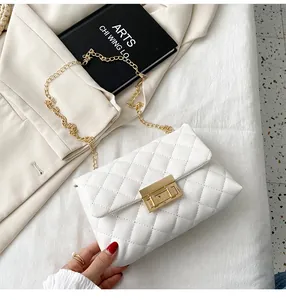 White quilted crossbody bag with golden chain strap and stylish square lock detail