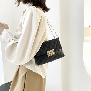 Elegant black quilted chain shoulder bag featuring a classic gold lock for fashion-conscious women