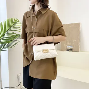 Elegant white quilted chain strap crossbody bag with gold-tone lock for stylish women