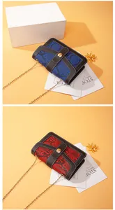 Fashionable snake pattern crossbody chain bags in blue and red color options