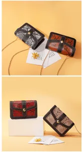 Elegant snakeskin print crossbody bag featuring gold chain strap and contrast trim design