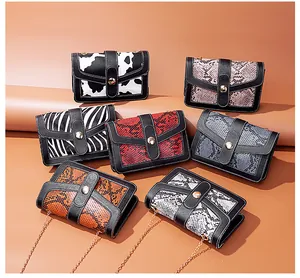 Stylish animal print crossbody bags with elegant gold chain straps shown together